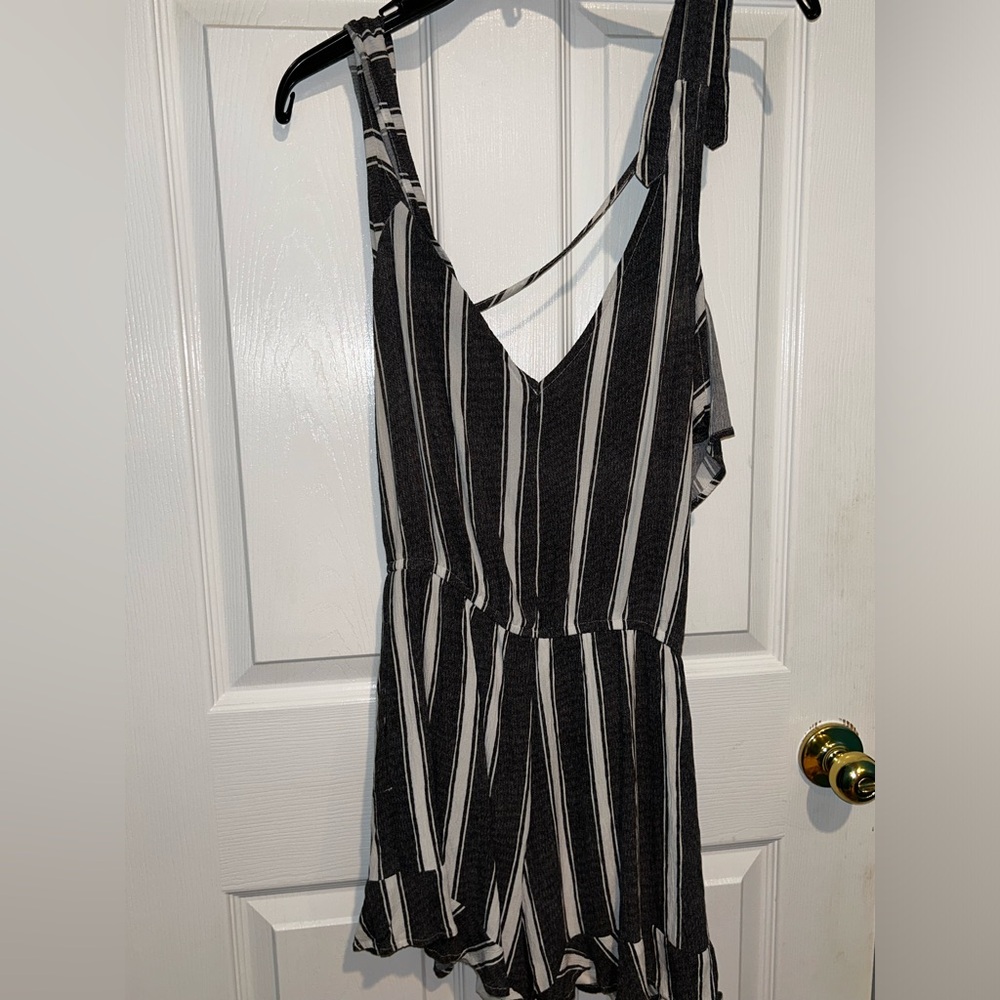 Black/gray/white romper, sleeveless and tied into cute bow on top